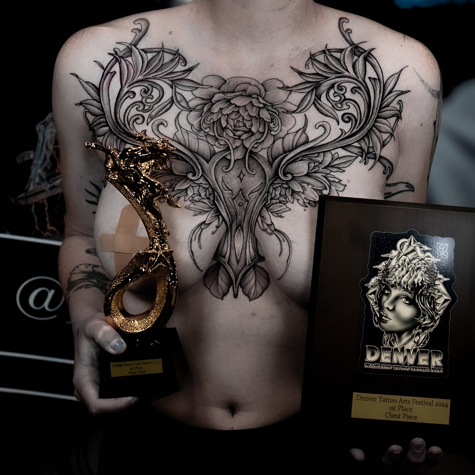 First place chest piece tattoo by Kel Otero with its trophy