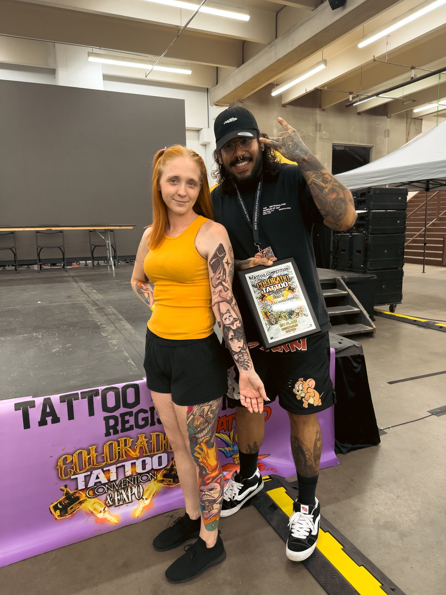 Kel Otero and his client with the Best Anime award at the Colorado Tattoo Convention